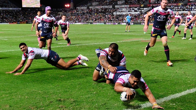Matthew Wright of the Cowboys scores a try during the round 10 NRL match against the Sydney Roosters in Townsville, Australia