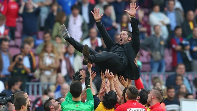 Atletico Madrid manager Diego Simeone is thrown in the air by his players after winning the La Liga after the match against Barcelona at Camp Nou, Spain