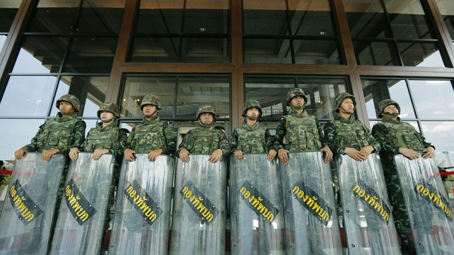 Soldiers stand guard at the Army Club in Bangkok, Thailand