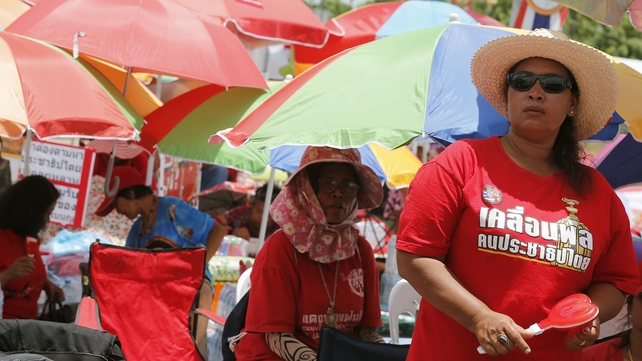 Thai 'red shirt' pro-government protesters rally on the outskirts of Bangkok