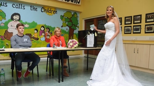 Bride Amanda Hanly voting on her way to the church at Kilteevan, close to Roscommon town earlier today (Pic: Gerard O'Loughlin)