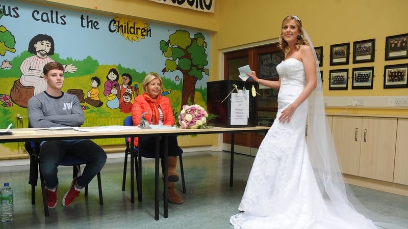 Bride Amanda Hanly voting on her way to the church at Kilteevan, close to Roscommon town earlier today (Pic: Gerard O'Loughlin)