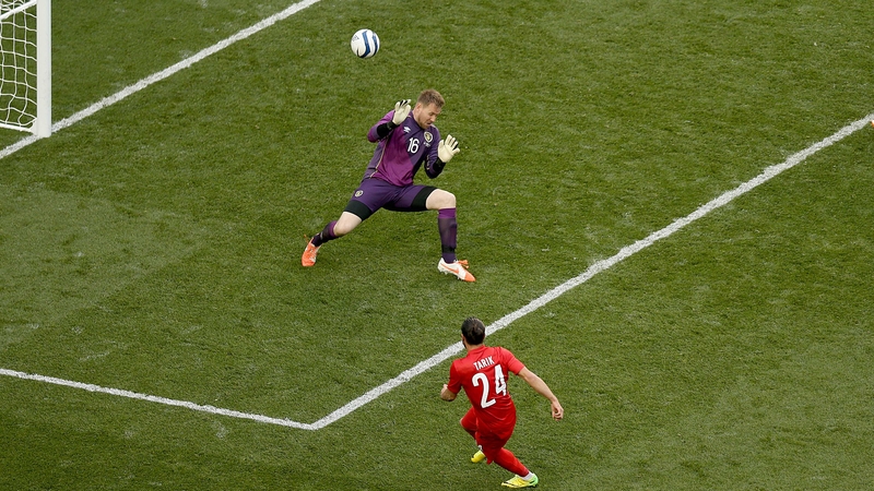 Tarik Camdal slots the ball past Rob Elliot to give Turkey a 2-0 lead at Aviva Stadium