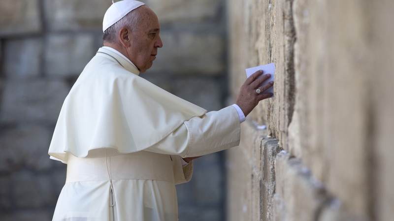 Pope Francis leaves a card at the Western Wall in Jerusalem's Old City