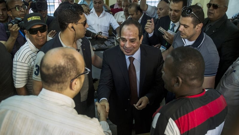 Egypt's ex-army chief and leading presidential candidate Abdel Fattah al-Sisi (Centre) arrives to vote in Cairo