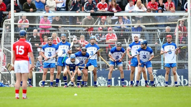 Patrick Horgan lines up a free with a wall of Waterford defenders standing in his way