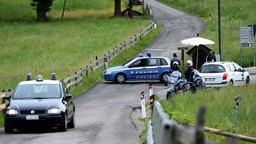 Italian police close a road following an accident near Germany's training camp in San Martino