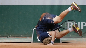 Russia's Dmitry Tursunov falls down during his French Open second round match against the USA's Sam Querrey