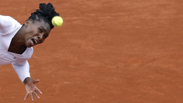 Venus Williams eyes the ball during her French Open second round match against Slovakia's Anna Schmiedlova