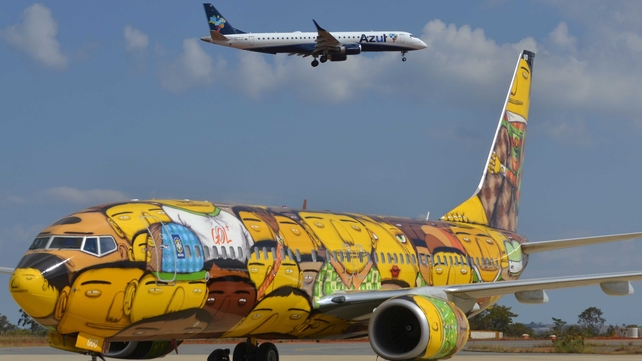 The airplane that will transport the Brazilian national football team across the country during the FIFA World Cup Brazil 2014, painted by graffiti artists and identical twin brothers Otavio and Gustavo Pandolfo