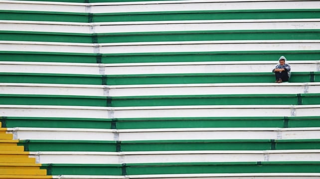 A fan of Chapecoense waits before his side's match against Palmeiras