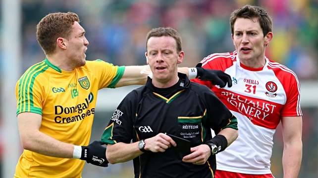 Derry's James Kielt reacts after receiving a black card from referee Joe McQuillan