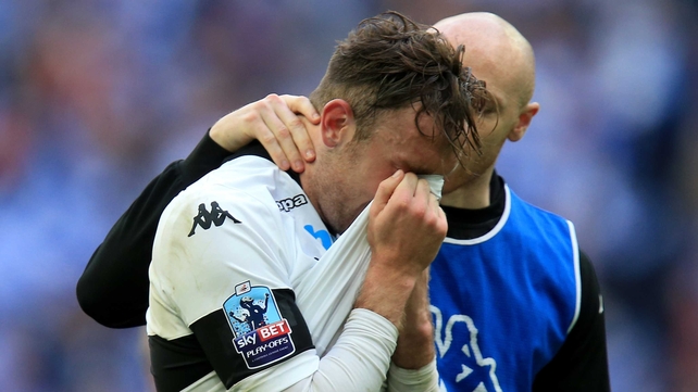 Derby County's Richard Keogh is consoled by team-mate Conor Sammon after the final whistle of the Championship play-off