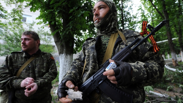 Pro-Russian militants stand guard in Semyonovka village, not far from Slaviansk