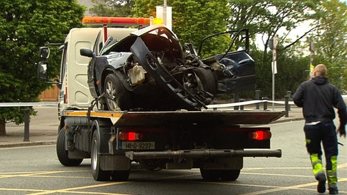 A woman in her 40s died when the car she was travelling in hit a pole in Fairview