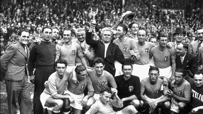 The victorious Italian team celebrate with the World Cup