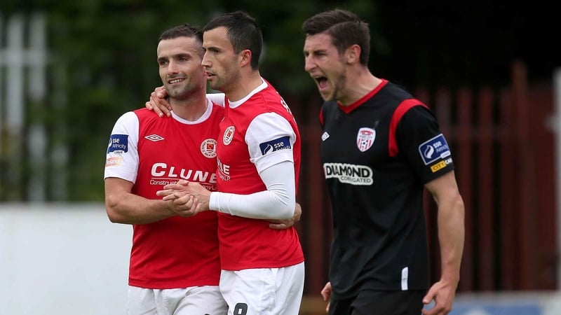 Chris Fagan and Keith Fahey celebrate while Derry suffered at Richmond Park