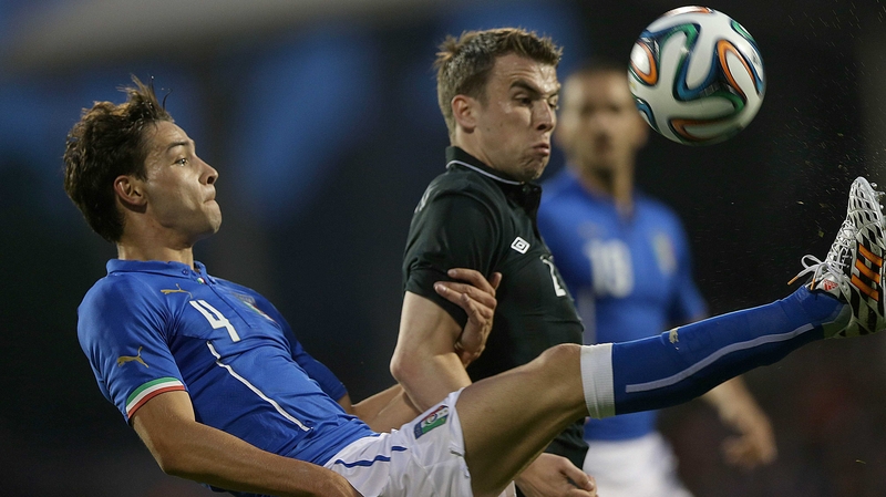 Italy's Mattia De Sciglio with Seamus Coleman battle for possesson at Craven Cottage