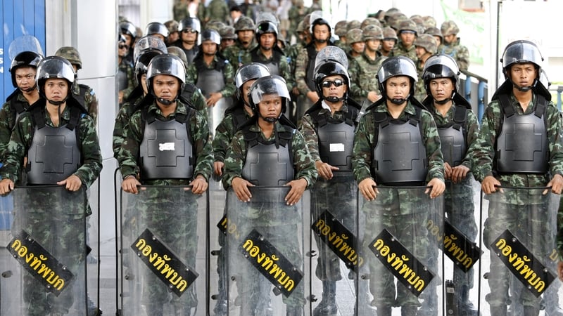 Thai soldiers prevent an anti-coup protest rally at a shopping district in Bangkok