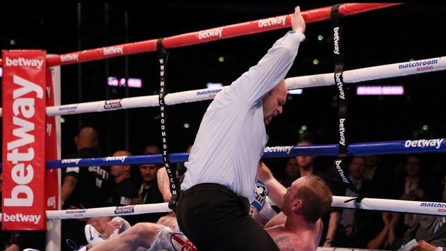George Groves is counted out by the referee after being knocked down by Carl Froch during the IBF and WBA World Super Middleweight Title fight at Wembley