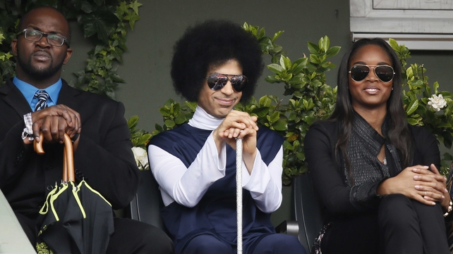 US singer Prince attends the French Open fourth round match between Spain's Rafael Nadal and Serbia's Dusan Lajovic on Court Philippe Chatrier at Roland Garros court
