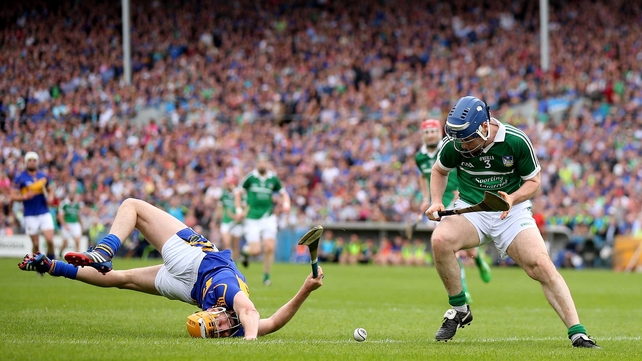 Tipperary's Seamus Callanan comes a cropper with Richie McCarthy of Limerick in their Munster SHC
