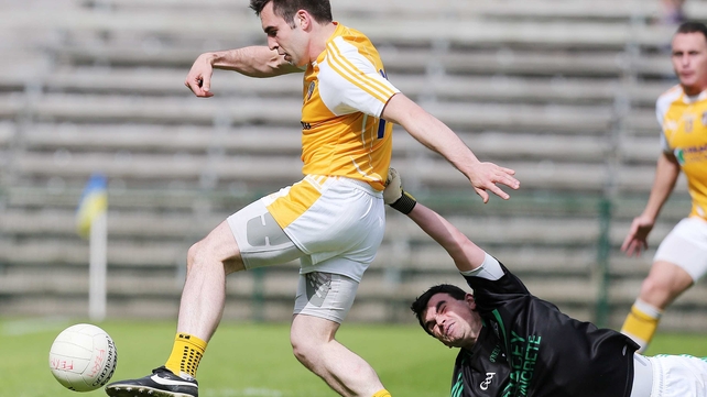 Antrim's Kevin Niblock gets past Fermanagh goalkeeper Chris Snow to score a goal in their Ulster SFC clash