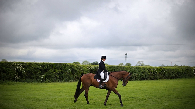 Georgia Bale, Great Britain, on Step Forward, in the practice arena before the dressage competition at Tattersalls