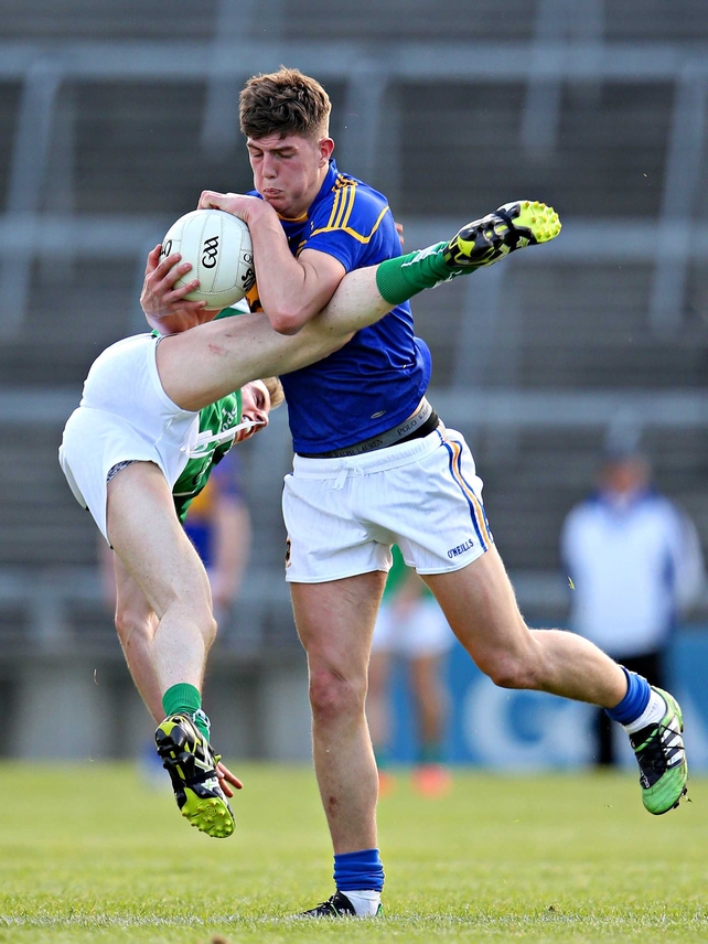 Limerick's Seanie Buckley (horizontal) battles with Steven O’Brien of Tipperary (vertical)