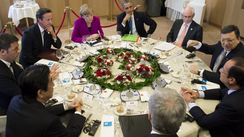 US President Barack Obama (C) sits alongside other G7 leaders during talks in Brussels