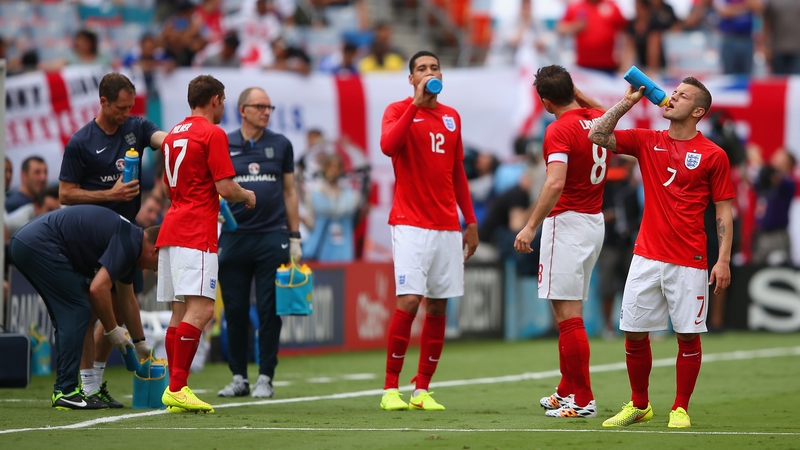 English players taking on water in the Miami heat