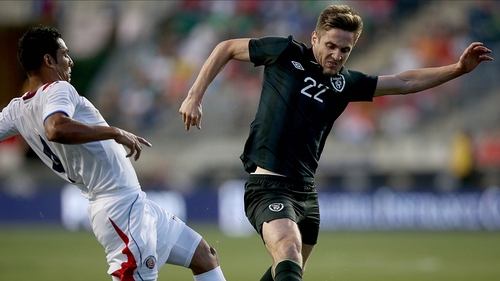 Ireland's Kevin Doyle with Michael Umana of Costa Rica during the game