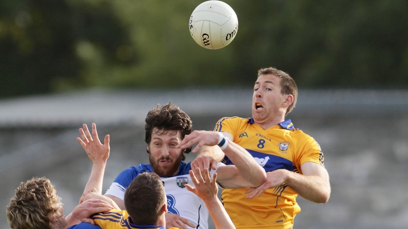 Tommy Prendergast of Waterford with Gary Brennan of Clare (R)