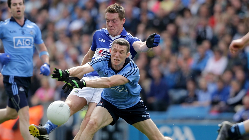 Laois' Darren Strong with Darren Daly of Dublin battle for the ball