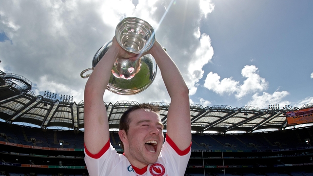 Tyrone's Conor Grogan celebrates with the Nicky Rackard Cup