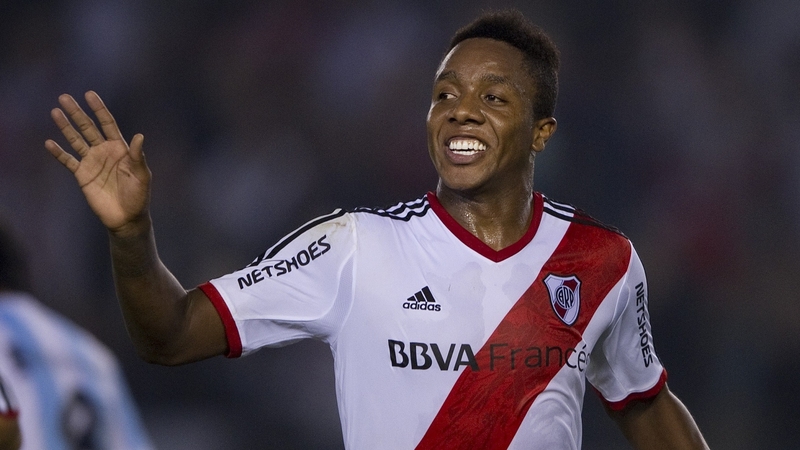 River Plate's midfielder Carlos Carbonero (R) celebrates scoring a goal with his club