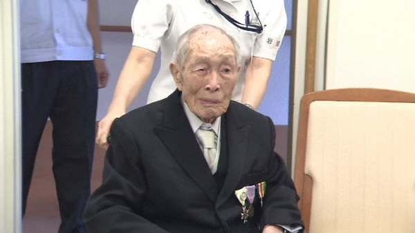 Sakari Momoi is a retired Japanese school teacher