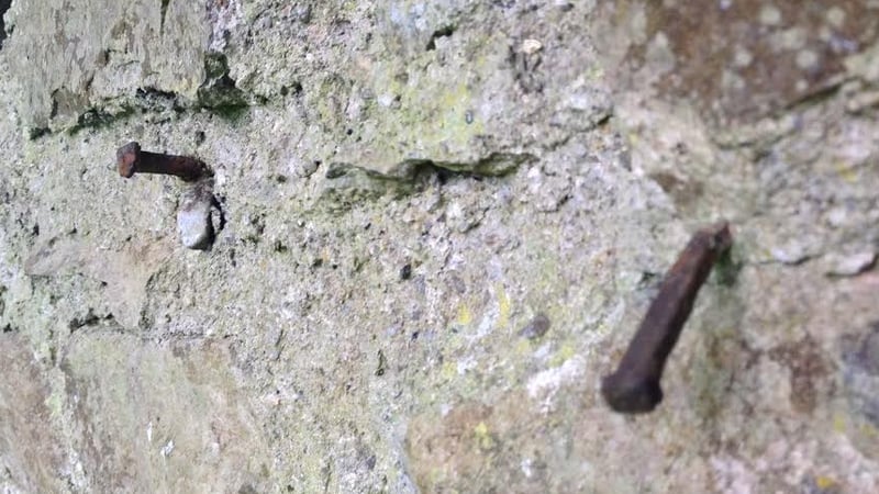 Locals say nails in the wall acted as headstones