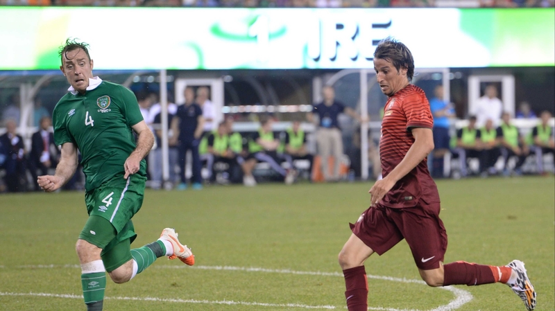 Richard Keogh (L) in action against  Fabio Coentrao on Wednesday