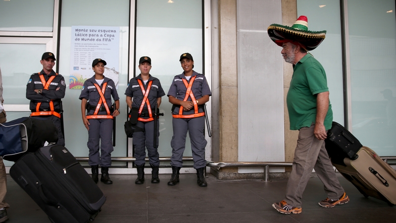 A Mexican soccer fan arrives at the Rio de Janeiro Galeao International Airport