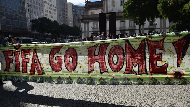 A huge banner against FIFA is carried during an anti-World Cup protest in Rio de Janeiro
