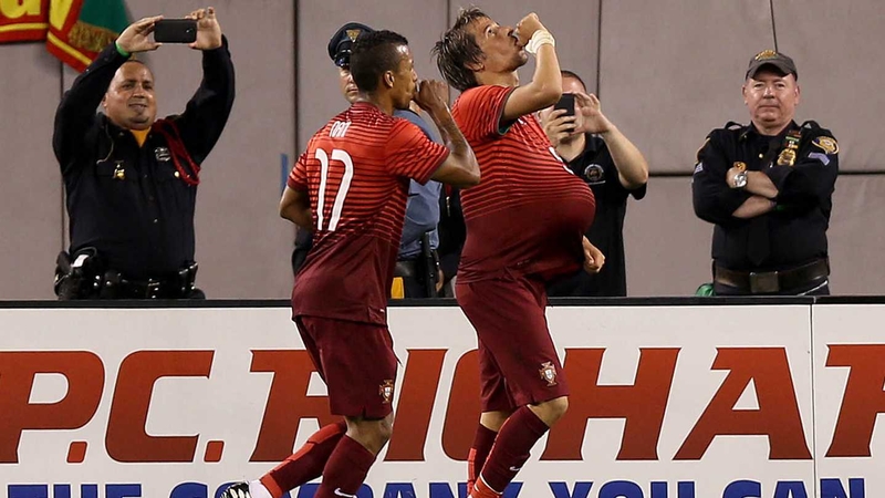Portugal's Fabio Coentrao celebrates scoring against Ireland with Nani