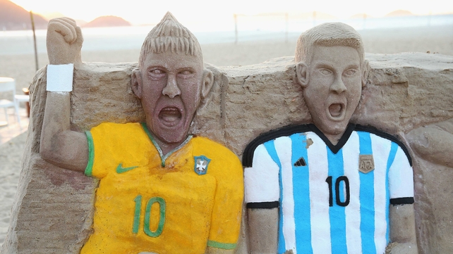A sandcastle of Neymar of Brazil and Lionel Messi of Argentina on Copacabana beach on Monday