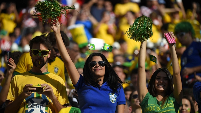 Brazil fans do the same in the sunshine