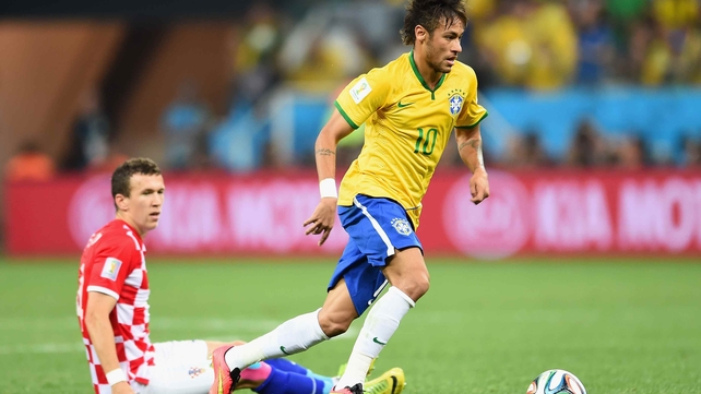 Neymar runs down the pitch, hunting for a seam in the defence