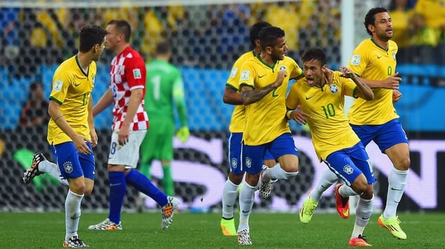 Neymar and his team-mates celebrate his goal