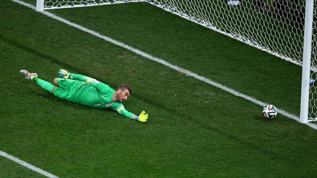 Croatia's goalkeeper Stipe Pletikosa extends but misses Neymar's strike