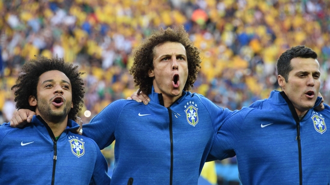 Brazilian defenders David Luiz and Marcello proudly sing their national anthem