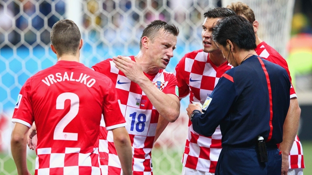Lovren's team-mates furiously contest the call