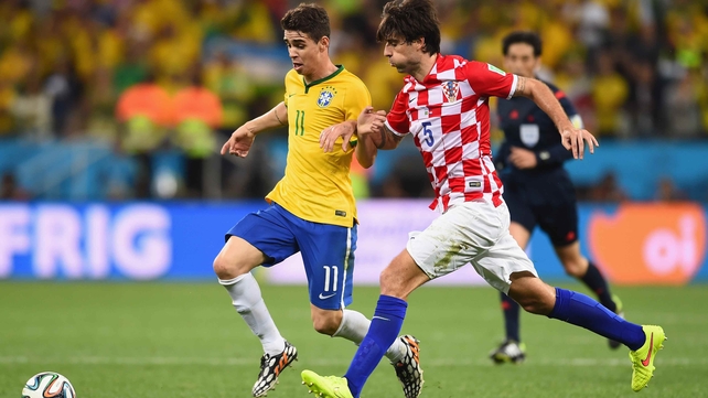 Brazilian midfielder Oscar scampers ahead in the first minute of extra time